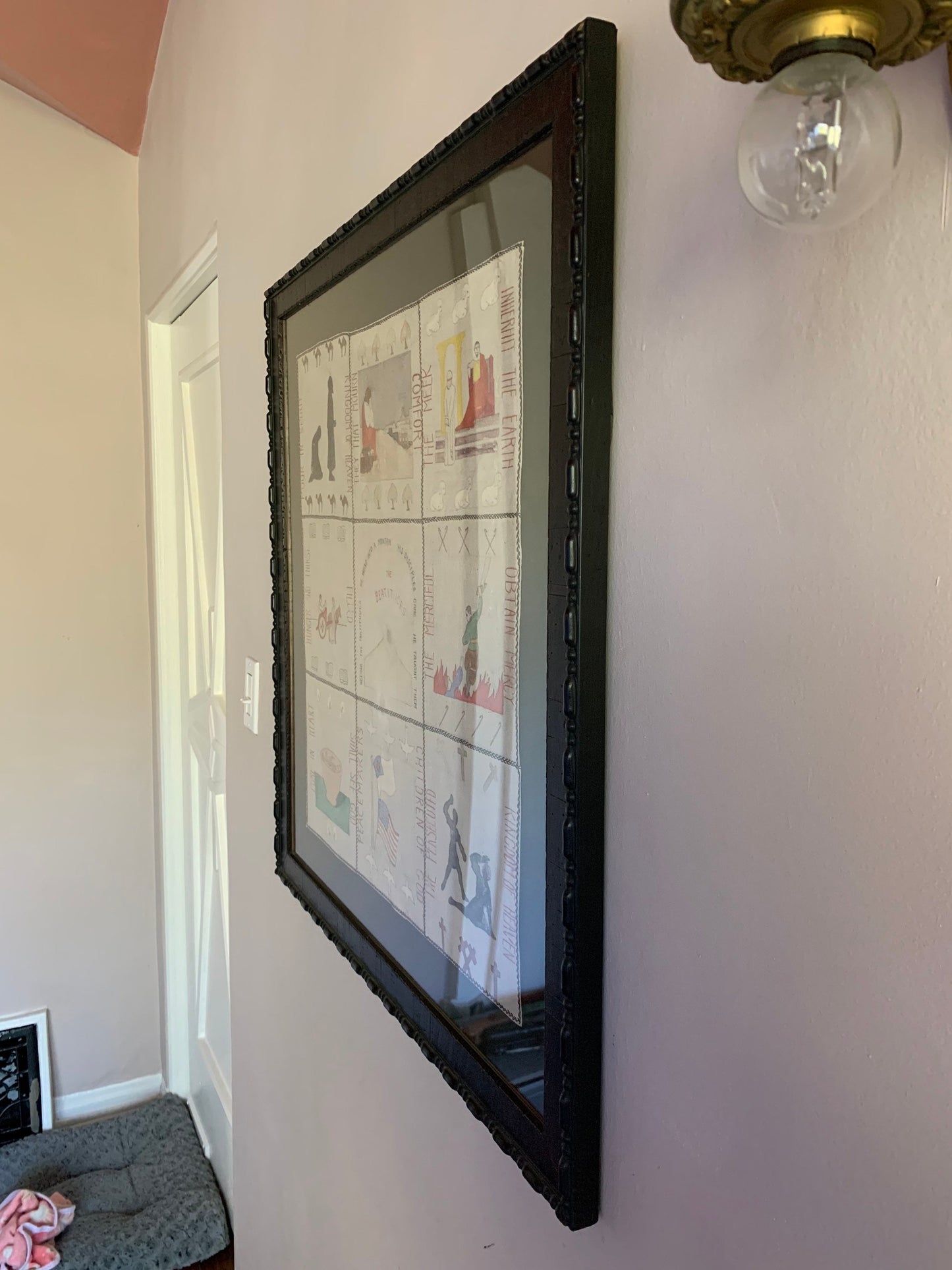 1920s prayer blanket in carved wood frame