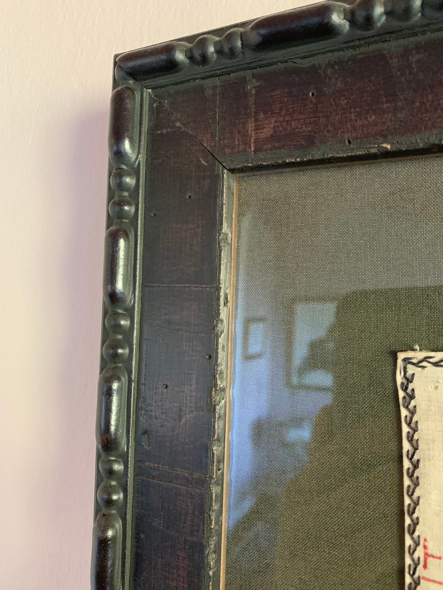 1920s prayer blanket in carved wood frame