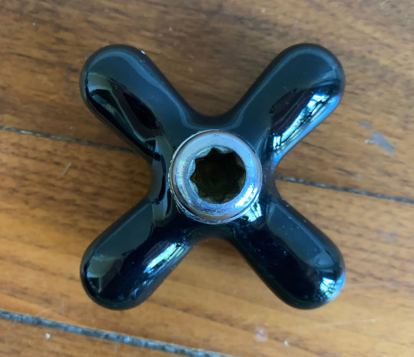 Black art deco faucet hot water handle