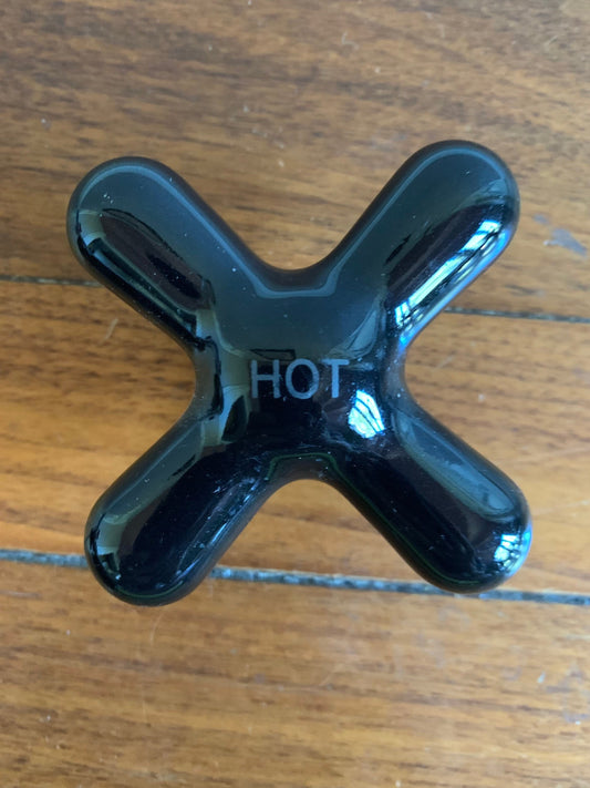 Black art deco faucet hot water handle