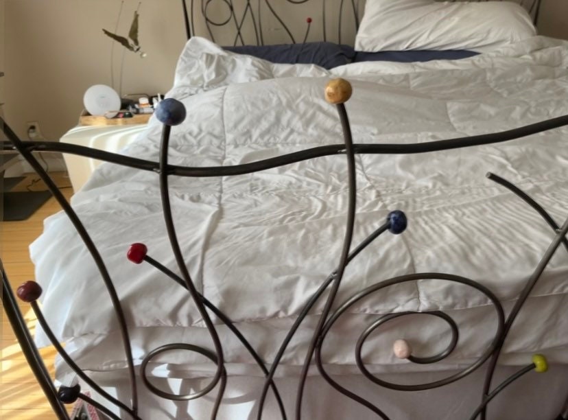 Vintage Iron Bed with Whimsical Design
