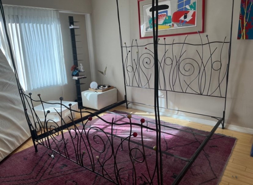 Vintage Iron Bed with Whimsical Design