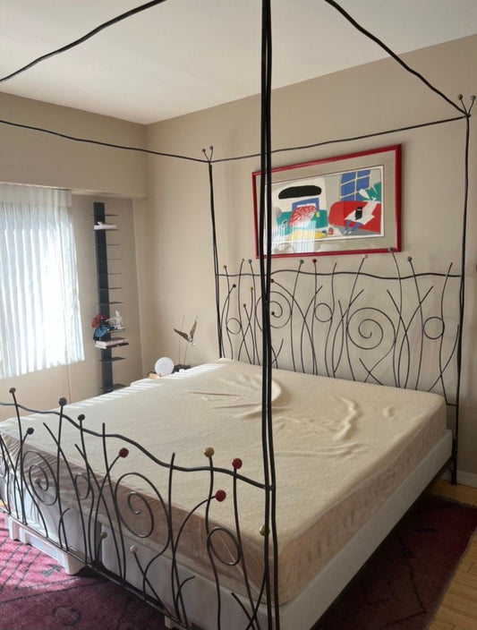 Vintage Iron Bed with Whimsical Design