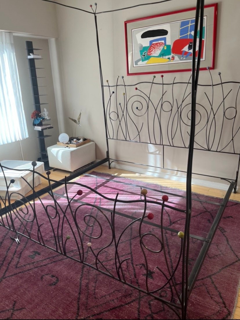Vintage Iron Bed with Whimsical Design